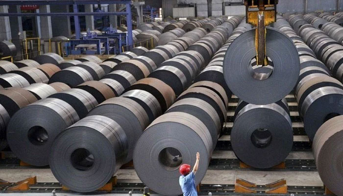 A representational image showing a steel manufacturing plant floor with  stocked metal sheet rolls. — AFP/File