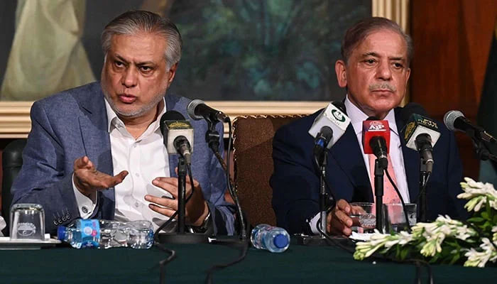 Prime Minister Shehbaz Sharif (right) and Foreign Minister Ishaq Dar address a press conference in Lahore.  — AFP/File