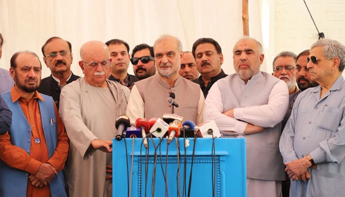 Jamaat-e-Islami (JI) Ameer Hafiz Naeem ur Rehman (C) speaks to media persons along with Mahmood Khan Achakzai (L) and Asad Qaiser (R) on May 4, 2024. — Facebook/Hafiz Naeem ur Rehman