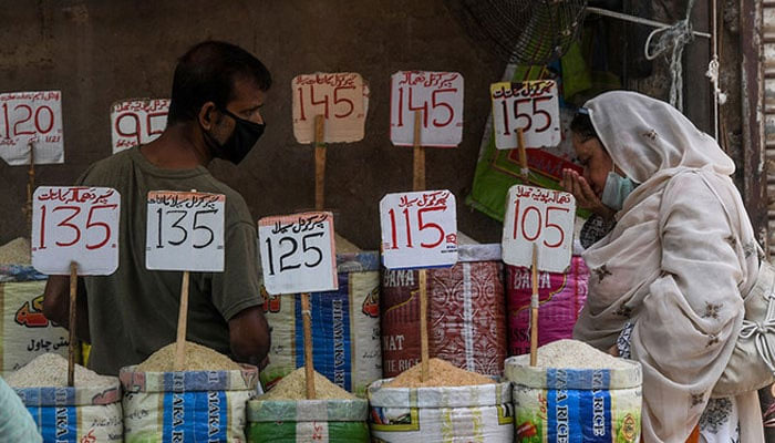 A representational image showing price tags for various typed of rice at a shop. — AFP/File