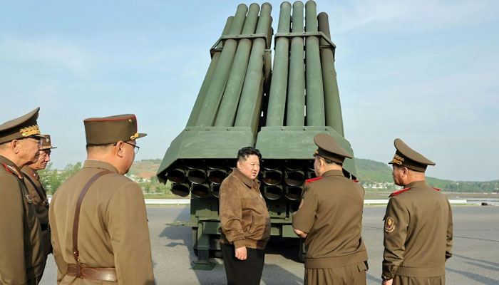 North Korean leader Kim Jong Un inspects the 240mm multiple rocket launcher system at an undisclosed location. — AFP File