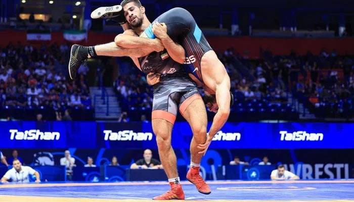 A representational image of two wrestlers during a wrestling match. — UWW website/File