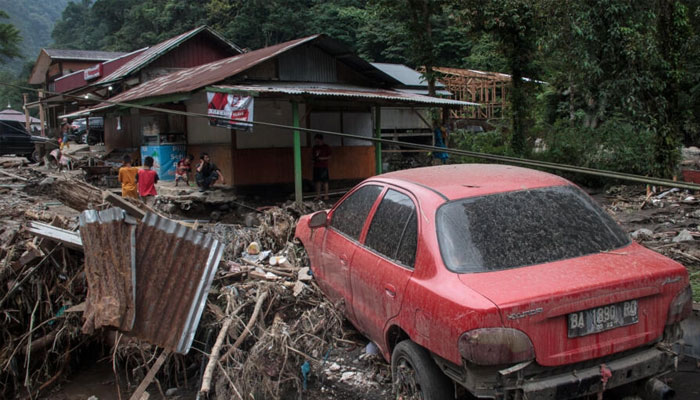 Flash floods and cold lava flow from a volcano hit several districts in western Indonesia.— AFP/File