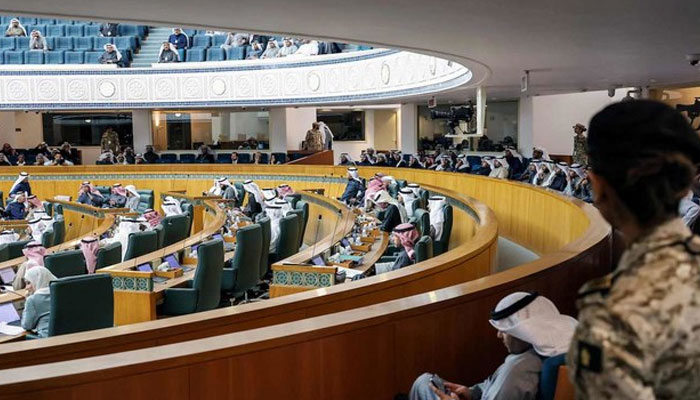 Female security guard stands by as Kuwaiti lawmakers attend a parliament session at the National Assembly in Kuwait City. — AFP/File