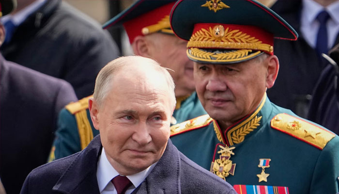 Russia’s president, Vladimir Putin, left, and outgoing defence minister Sergei Shoigu leaving Red Square after the Victory Day military parade in Moscow on Thursday. — AFP/File