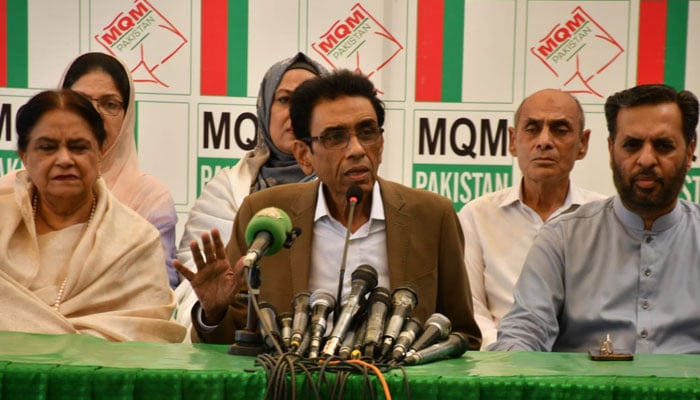 MQM-Ps newly appointed Chairman Dr Khalid Maqbool Siddiqui (centre) addresses a presser in this image released on May 10, 2024. — X/@MQMPKOfficial