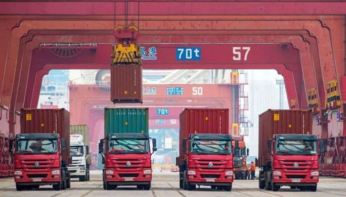 A representational image of containers being loaded on to trucks at  a Chinese port in this image.—AFP/File