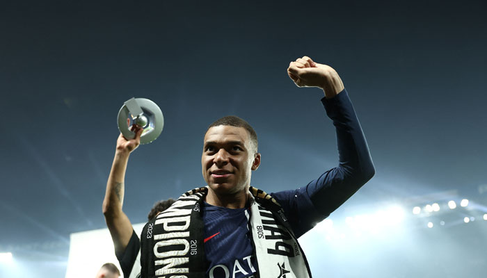 Paris Saint-Germains French forward Kylian Mbappe celebrates during a ceremony following the French L1 football match between Paris Saint-Germain (PSG) and Toulouse (TFC) on May 12, 2024 at the Parc des Princes stadium in Paris. — Reuters