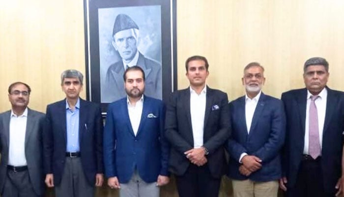 Punjab Agriculture Minister Syed Ashiq Hussain Kirmani (C to L) and  Country Head of Syngenta Pakistan Private Limited Company Zeeshan Haseeb Baig (C to R) pose for a group photo on May 14, 2024. — Facebook/Syed Ashiq Hussain Kirmani