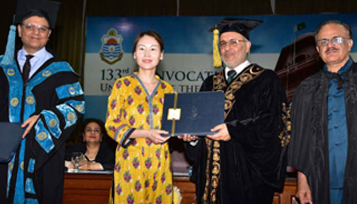 In this image, PU VC Prof Dr Khalid Mahmood awards  PhD degree to a Chinese scholar in the university’s 133rd Convocation on May 14, 2024. — PU Website