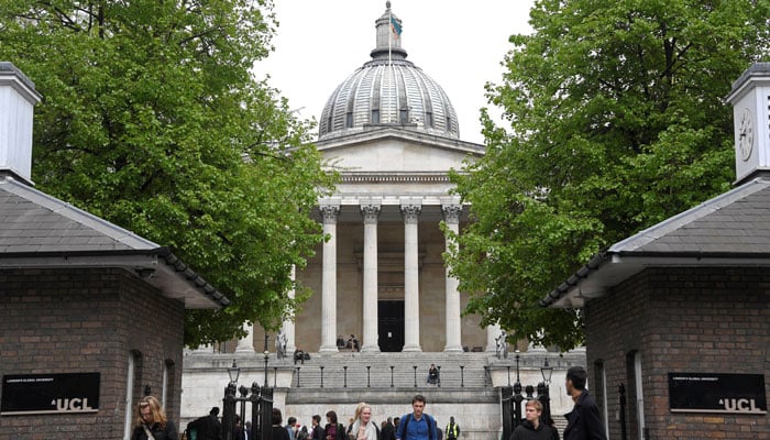 Students and visitors are seen walking around the main campus buildings of University College London (UCL), part of the University of London, Britain. — Reuters/File