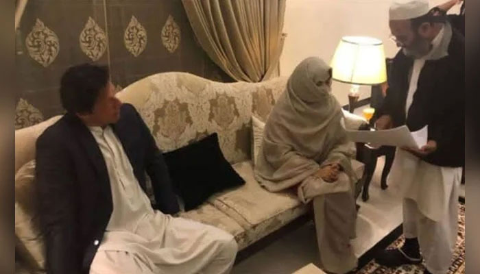 Former prime minister Imran Khan (left) pictured alongside his wife Bushra Bibi during their nikah. — Photo via Khlid Iqbal/File