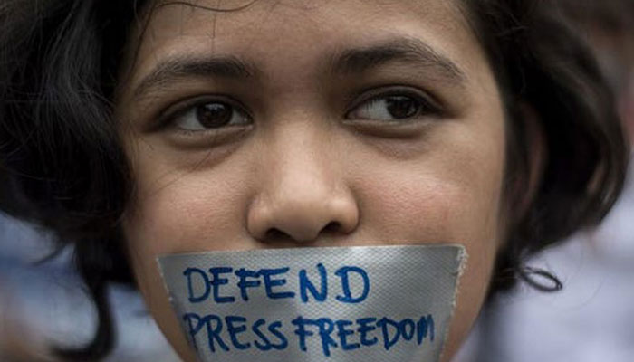 A representational image of a protester calling for defence of press freedom. — AFP/File