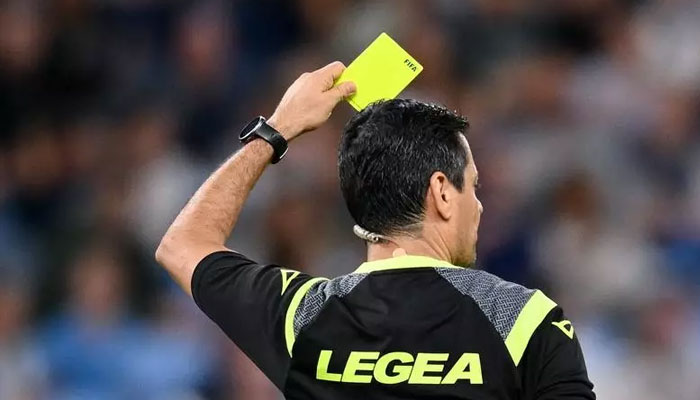 A football referee showing a yellow card.— AAP/file