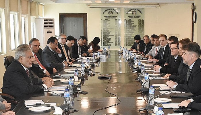 This handout photograph released by the Pakistan Press Information Department (PID) on Jan. 31, 2023, shows Pakistani and International Monetary Fund officials meeting at the Finance Ministry in Islamabad.—AFP