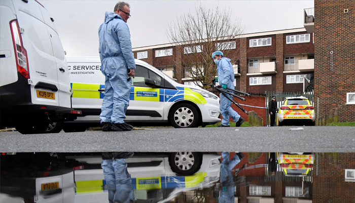 Police and forensics officers work near the scene of a fatal stabbing as British police said they were investigating at least five separate serious violent incidents in Croydon, London, Britain. — Reuters/File