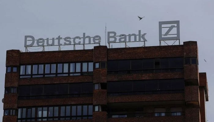 The logo of Deutsche Bank is seen on the roof of a building outside a Deutsche Bank branch office in Malaga. — Reuters File
