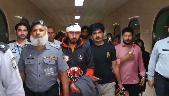 Wounded students are being escorted upon reaching Pakistan after they left Kyrgyzstan on May 18, 2024. — Screengrab/X/@Iam_Mian