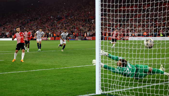 Southamptons Adam Armstrong scores their third goal from the penalty spot in Play-Off Semi Final in Second Leg in a match against West Bromwich Albion at St Marys Stadium, Southampton, Britain on May 17, 2024. — Reuters