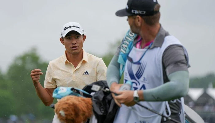 Collin Morikawa talks to his caddie after finishing the 18th hole during the second round of the PGA Championship golf tournament at Valhalla Golf Club in Louisville, Kentucky, USA on May 17, 2024. — USA TODAY Sports