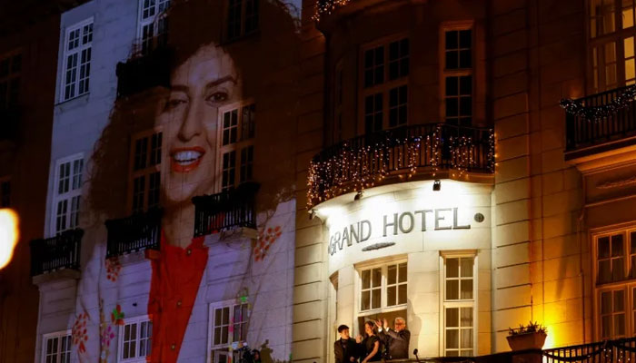 A picture of Narges Mohammadi on the wall of the Grand Hotel in central Oslo before the Nobel banquet. — Reuters File