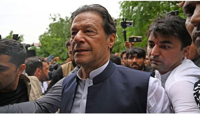 Former prime minister Imran Khan arrives to appear before an anti-terrorism court in Islamabad on August 25, 2022. — AFP