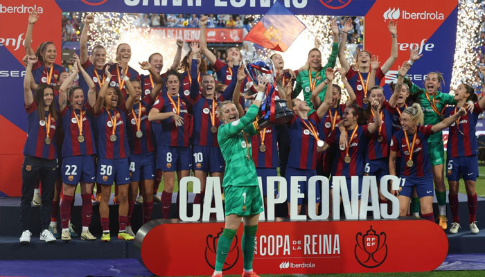 Barcelona womens team celebrating after winning Copa de la Reina on May 19, 2024.—ESPN