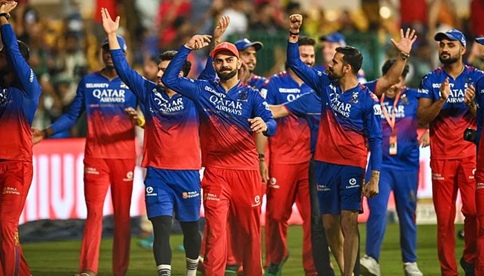 RCB players celebrate after winning the Indian Premier League (IPL) Twenty20 cricket match against Chennai Super Kings at the M Chinnaswamy Stadium in Bengaluru on 18 May, 2024. — AFP