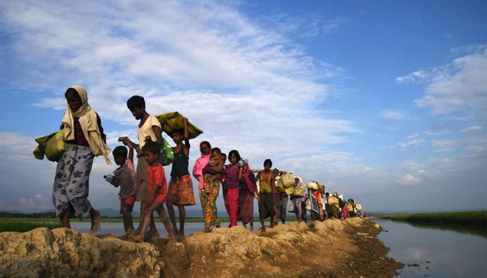 Rohingya refugees flee fighting in Myanmar’s Rakhine state amid junta-rebel clashes. — AFP/file