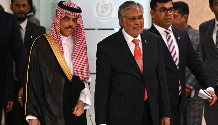 Saudi Foreign Minister Prince Faisal bin Farhan (L) and his Pakistans counterpart Ishaq Dar arrive to address a joint press conference at the foreign ministry in Islamabad on April 16, 2024. — AFP/File