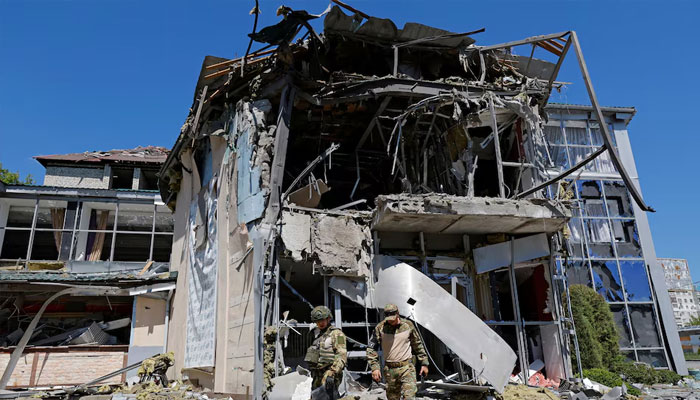 Russian military investigators work in a restaurant building hit by recent shelling, which local authorities called a Ukrainian military strike, in the course of Russia-Ukraine conflict in Donetsk, May 11, 2024. — Reuters