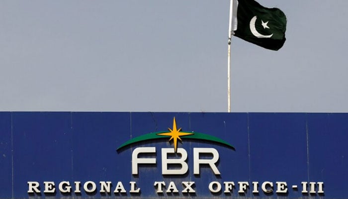 The national flag is seen on the Federal Board of Revenue (FBR) office building in Karachi, Pakistan.  — Reuters/File