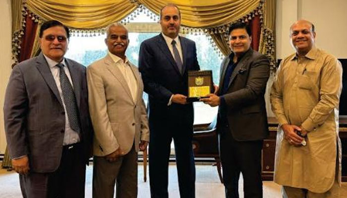 Islamabad Chamber of Commerce and Industry (ICCI) President Ahsan Zafar Bakhtawari presents a souvenir to Ambassador of Qatar Ali Mubarak Ali Essa Al-Khater in this image. — Islamabad/File
