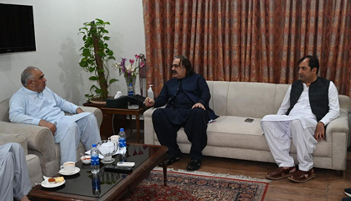 PTI leader and former speaker of the National Assembly, Asad Qaiser (L) exchange of views with KP, CM  Ali Amin Gandapur (C) at the Chief Minister’s House on May 20, 2024. — Facebook/Ali Amin Khan Gandapur