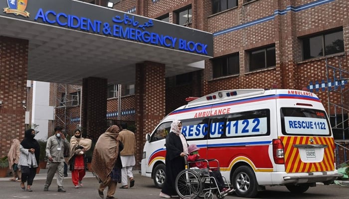 People walk at the Childrens Hospital in Lahore on January 31, 2024. — AFP