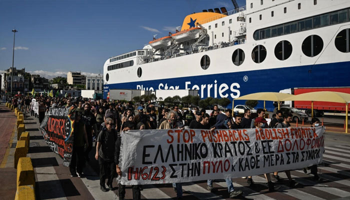 People proesting in front of a ship in this undated photo.— AFP/file