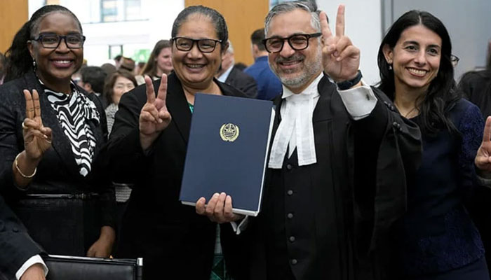 Payam Akhavan, lead counsel for the nine island nations, poses with other lawyers after The International Tribunal for the Law of the Sea (ITLOS) in Hamburg.— AFP/file