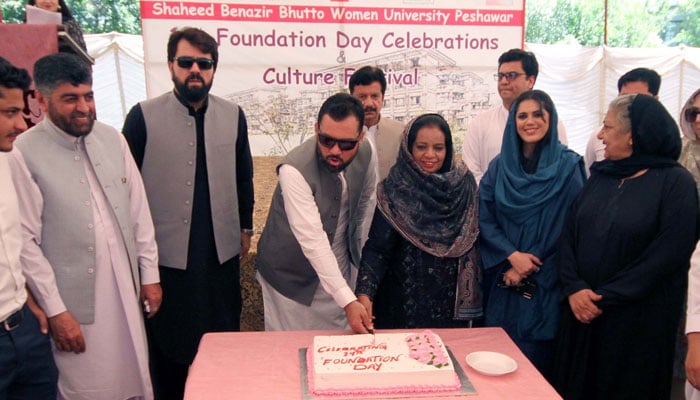 Provincial Minister for Higher Education, Meena Khan along with others cut cake during Foundation Day ceremony of the SBBWU at university premises in Peshawar on May 22, 2024. — PPI