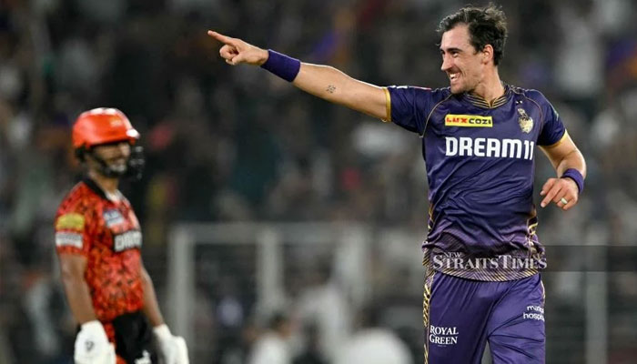 Kolkata Knight Riders’ Mitchell Starc celebrates after taking the wicket of Sunrisers Hyderabad’s Shahbaz Ahmed (not pictured) during the Indian Premier League (IPL) T20 first qualifier match between SRH  and KKR at the Narendra Modi Stadium in Ahmedabad on May 21, 2024. — AFP