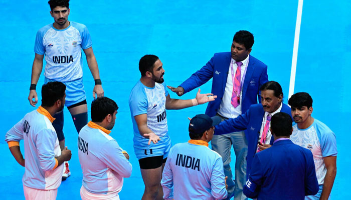 Indian Kabaddi players argue with referees on a disputed decision in the men’s kabaddi gold medal match between India and Iran during the Hangzhou 2022 Asian Games in China on October 7, 2023. — AFP