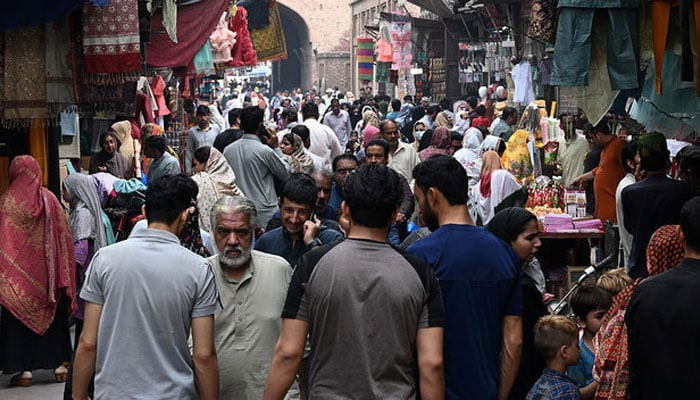 People throng a market area during shopping in Lahore in this picture taken on April 16, 2023. — AFP