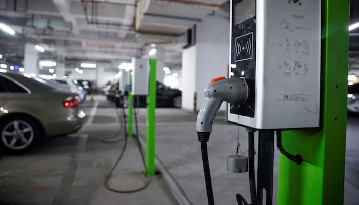 A electric car charging station is pictured in a parking lot. — Reuters/File