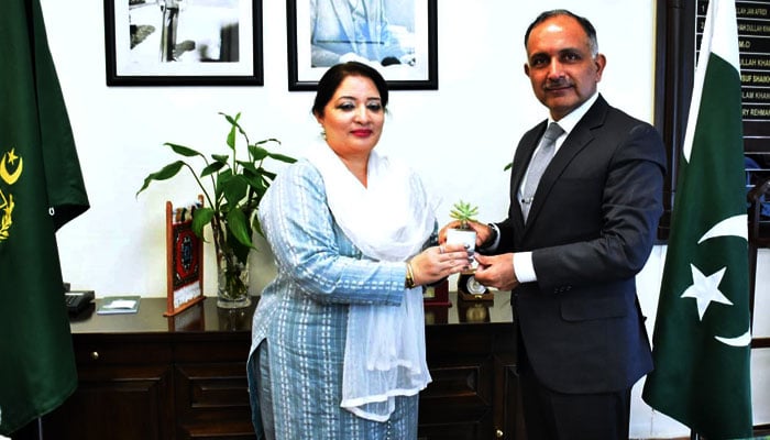 PMs Coordinator on Climate Change & Environmental Coordination Romina Khurshid Alam gifts a plant to Chairman NDMA Lieutenant General Inam Haider Malik on May 22, 2024. — APP