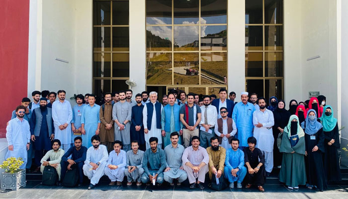 Participants pose for a group photo during a Youth Symposium on Perception Management, National Integration, and Entrepreneurship event at the University of Swat on May 23, 2024. — Facebook/University of Swat