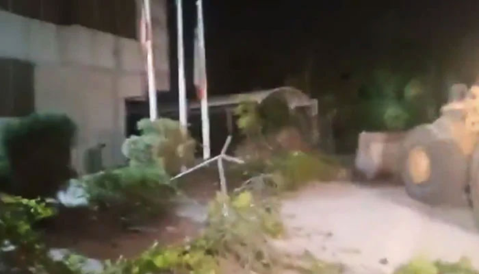 CDA machinery demolishing a portion of the PTIs Central Secretariat in Islamabad, on May 23, 2024, in this still taken from a video. — X/@PTIOfficial