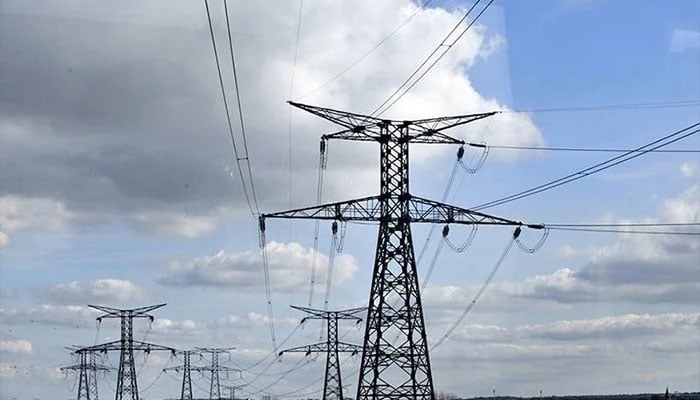 A representational image of pylons and high-transmission power lines. — AFP/File