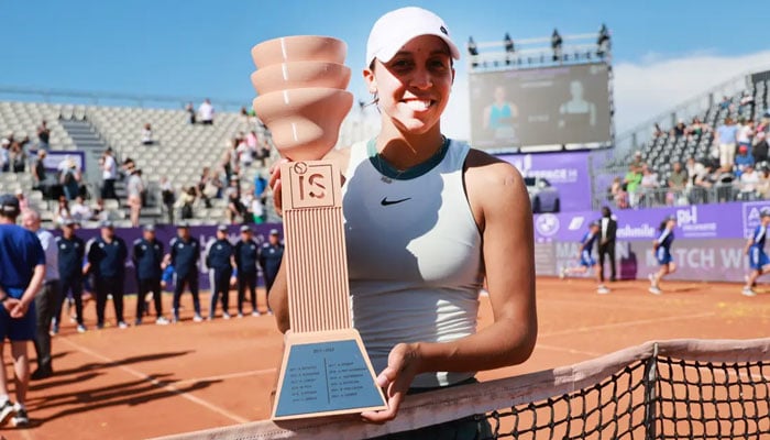 Madison Keys lifts the trophy of her first WTA title with victory over compatriot Danielle Collins in Strasbourg on May 25, 2024. — AFP