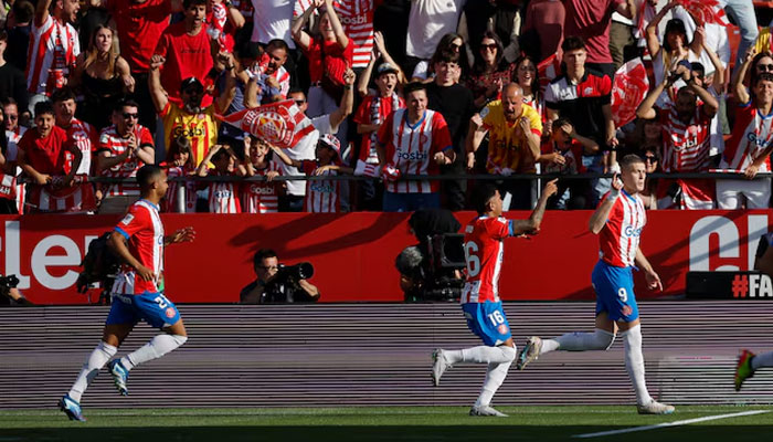 Gironas Artem Dovbyk celebrates scoring their first goal with teammates against Barcelona on May 4, 2024. — REUTERS