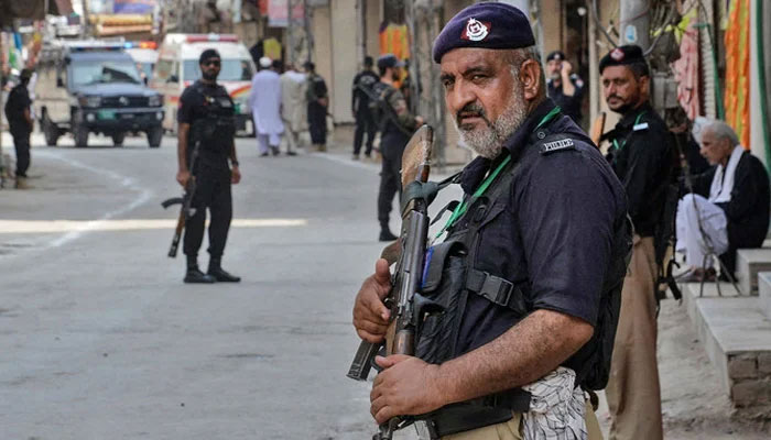 This image shows a police personnel standing guard in Peshawar. — AFP/File