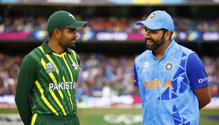 Pakistans skipper Babar Azam interacts with Indian captain Rohit Sharma. — ICC/file